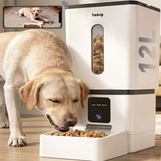 Dog eating from a white automatic pet feeder with a smartphone app interface.
