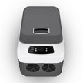 Portable refrigerator with a dark gray top and white body on a light gray background
